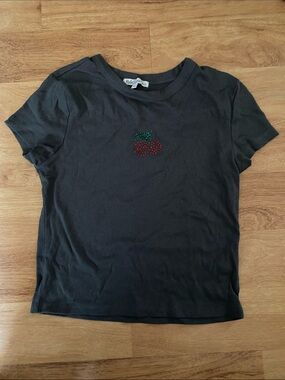 Rebellious One Black Ribbed Tee with Red Cherry Embellishment